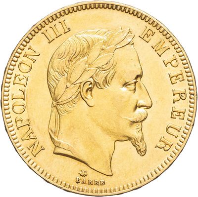 gros plan d'une pièce d'or sur laquelle figure le visage d'un homme