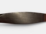 a knife that is laying on top of a white surface