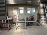a room with a ladder, a chair, and a window
