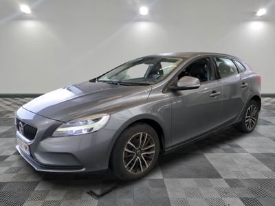 a grey volvo v40 wagon parked on a checkered floor