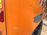 a close up of a construction vehicle with a sign on it