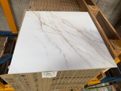 a close up of a white marble slab on a pallet
