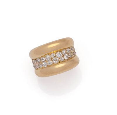 an 18k gold and diamond band ring