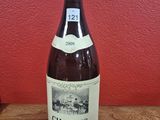a bottle of wine that is sitting on a table