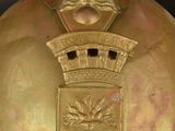 a gold helmet with a crown on top of it