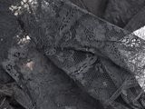 a close up of a piece of lace on the ground