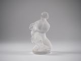 statue of a woman kneeling on a marble base