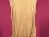 a woman ' s tan sweater vest on a mannequin mannequin mannequin mannequin mannequin mannequin mannequin manne