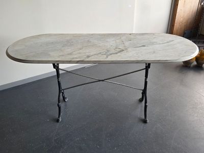 a table with a marble top in a room