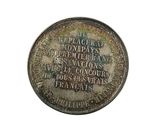 an image of a silver coin with the names of the countries on it