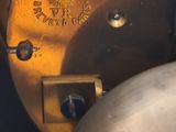 an image of a close up of a clock on a table