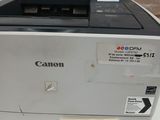 a canon printer sitting on a table with a price tag on it