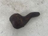 a small pipe sitting in the snow on the ground