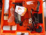 a orange box with tools in it sitting on a table