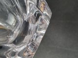 a close up of a clear glass vase on a table