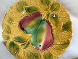 a plate with a bird on it and a bowl with a bird on it