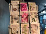 many cards on a rack in a room
