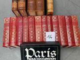 a stack of books sitting on top of a table next to each other