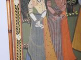 a picture of a painting of a woman and a man with a dog