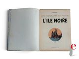 an open book with a picture of a boat in the water
