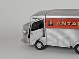 a toy truck that is sitting on a white surface