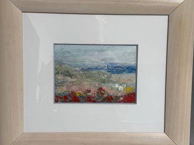 tableau représentant un champ de fleurs avec un ciel bleu en arrière-plan