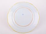 an image of a white plate with a yellow rim on a white surface
