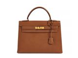 a brown leather handbag on a white background