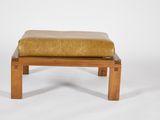 an image of a wooden bench with a yellow cushion on it