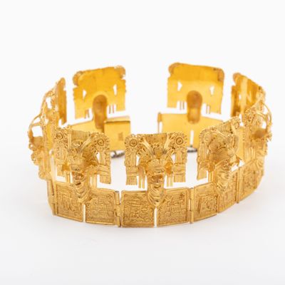 an image of a gold bracelet on a white background