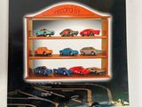 a close up of a book on a shelf with cars on it