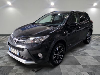 the toyota rav is parked on a checkered floor