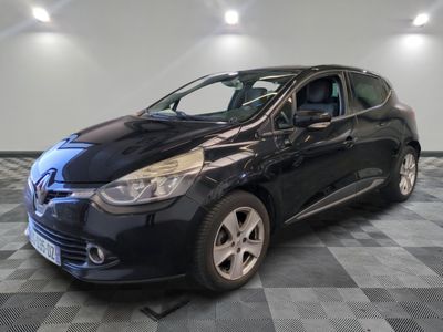 the black car is parked on a checkered tile floor
