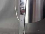 a lamp that is sitting on a metal stand