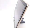 a tablet computer sitting on top of a stand
