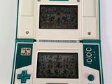 a small game console with a game on the screen