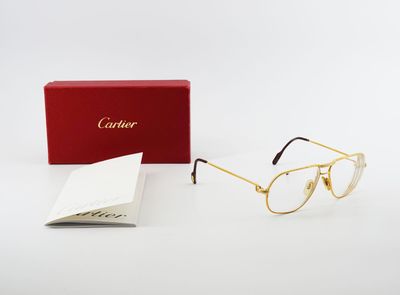 a pair of glasses with a red box on a white surface