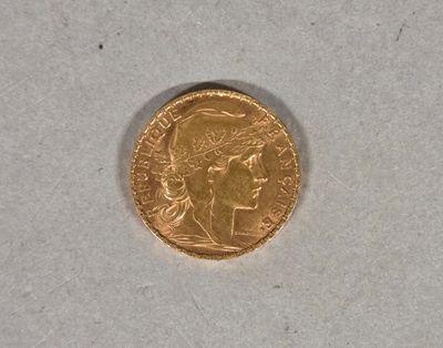 an image of a gold coin sitting on top of a white surface