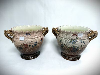 two vases that are sitting next to each other on a table