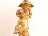 a statue of a child holding a flower pot