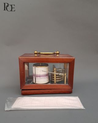 a small wooden box with a glass case on top of it