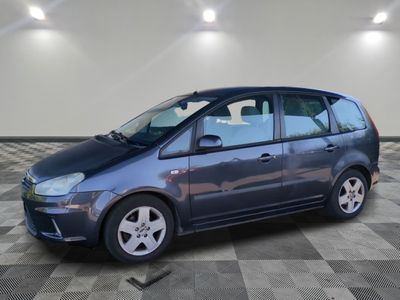 a picture of a small blue car parked in a garage