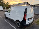 a white van that is parked in a parking lot