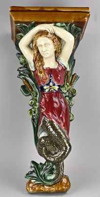 a vase with a woman holding a fish on it