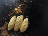 three pieces of bread that are on a black plate
