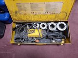 a yellow box with tools inside of it on the floor