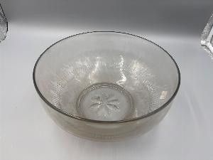 a glass bowl sitting on top of a white counter