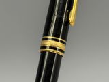 an image of a pen with a gold band on it