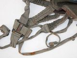 a small backpack with a strap on it and a camera attached to it