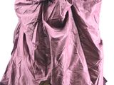 a woman in a purple dress that has a cat inside of it